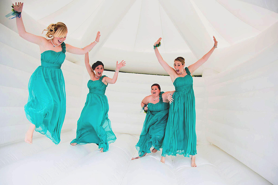 Bridesmaids bouncing on The White Castle at a wedding Ibiza - Bodas de Ibiza Castillo Hinchable